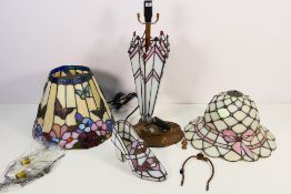 A boxed Tiffany style table lamp and one further Tiffany style lampshade with butterfly decoration.