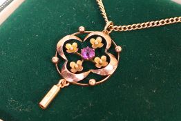 A rose metal (stamped 15ct) necklace and pendant,