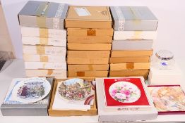 A quantity of boxed collector plates to include Royal Albert, Royal Doulton Window Shopping series,