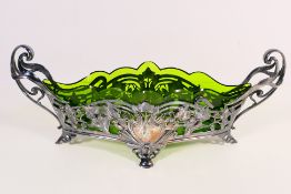 A German Art Nouveau or Jugendstil pewter, twin handled, flower dish with green glass liner,