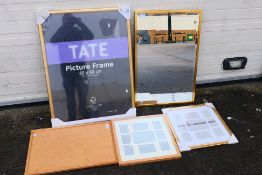 Lot to include a bevel edge wall mirror, cork notice board and a quantity of picture frames. [5].