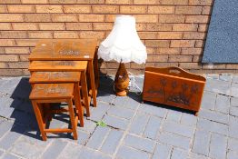An Oriental nest of four tables with carved decoration,