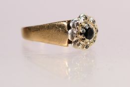 A 9ct yellow gold cluster ring, the principal stone surrounded by illusion set diamonds,