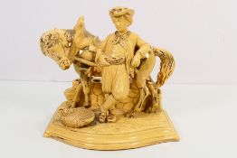 An Eichwald pottery novelty pipe stand, modelled as a young man and his horse,