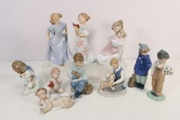 A collection of ten unboxed Nao and similar figures / groups,