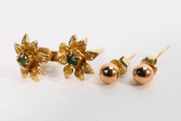 A pair of stone set ear studs in the form of flower heads and a pair of rose metal ear studs,