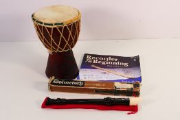 A traditional Djembe drum and a boxed Dolmetsch recorder.