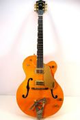 A Gretsch 6120 AM model electric guitar, made in Japan, serial number JF04060049, circa 2004,