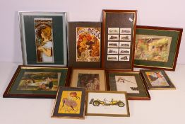 A collection of framed prints,