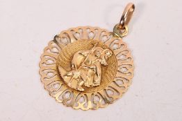 A 9ct yellow gold St Christopher pendant, 2.5 cm (d), approximately 2.3 grams.