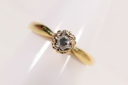 A 9ct yellow gold, illusion set diamond solitaire ring, size Q, approximately 2.5 grams.
