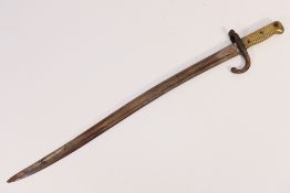 A French Model 1866 Chassepot bayonet with brass handle.