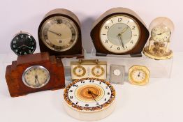 A collection of clocks to include mantel clocks, ceramic wall clock, anniversary clock and other.