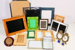 A box of picture / photograph frames, various designs and sizes.