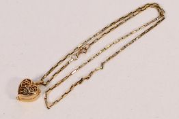 A 9ct yellow gold box link necklace with 9ct gold heart shaped, openwork,