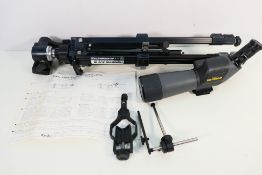 A Kenko Pro Field 63 spotting scope, model PF-63A with a Slik 88 Black Diamond tripod.