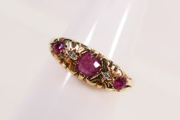 A 9ct yellow gold diamond and ruby set ring, size Q+½, approximately 3.5 grams.