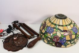 A large Tiffany style table lamp, the shade decorated with flowers and butterflies,
