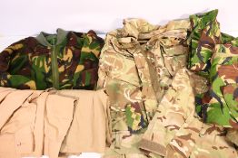 Military uniform comprising camouflage bearing insignia including Household Division and London