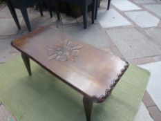 A coffee table, the top with carved decoration of floral motif approximately 43 cm x 42 cm x 97 cm.