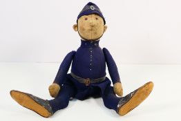Steiff - A early 20th century articulated policeman doll, cream head with painted details,