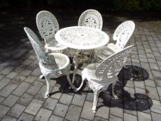 Garden Furniture - a vintage aluminium cast patio set comprising table and five chairs,