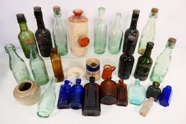 A collection of vintage glass bottles, s