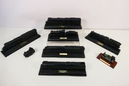 Six locomotive sculptures in coal by Kin