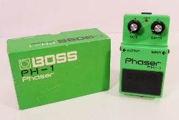 A boxed Boss Phaser guitar pedal, PH-1 (black label), Made In Japan.