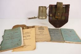 Lot to include a Dutch entrenching tool cover, military training manuals / handbooks,