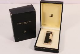 A Dunhill Rollagas cigarette lighter,