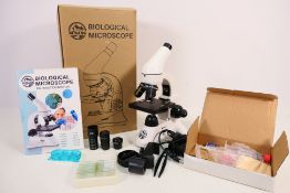 A boxed Bebang Biological Microscope.