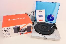 A boxed Oakcastle HIFI150 Micro Hifi and a Tevion Sound USB Turntable.
