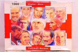 Two boxed Football Heroes make in the box 1,000 piece Jigsaw puzzles. Unchecked for completeness.