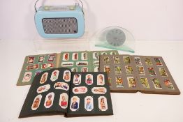 Lot to include four albums of cigarette cards, a KS Jive portable radio and an Art Deco style clock.