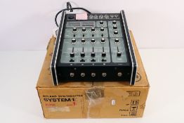 A Roland System 100, model 103 Mixing Amplifier for use with an analogue synthesiser, made in Japan,
