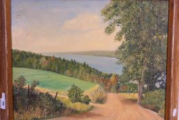 An oil on canvas landscape scene, signed by the artist lower left, framed,