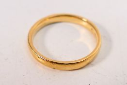 A 22ct gold wedding band, size M+½, approximately 3.5 grams.