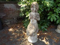 Architectural Garden Stoneware - a cast stone garden statue depicting a young girl holding a