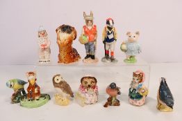 A collection of figures to include a Beswick Kitty MacBride Racegoer figures,