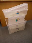 Eight various sized clear plastic boxes.