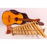 A Calung type bamboo xylophone and a Hi Spot acoustic guitar in soft case. [2].