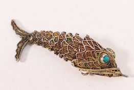 A white metal (stamped silver) filigree,
