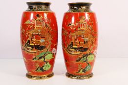 A pair of early 20th century Wiltshaw & Robinson Carlton Ware vases decorated in the Temple pattern