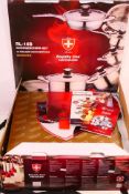 A boxed Royalty Line, Switzerland cookware set, appears unused.