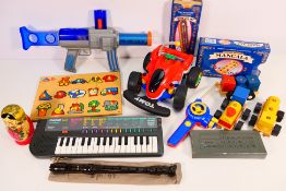 Tomy - Casio - Yamaha - A group of items including an unboxed Tomy r/c car, a Casio Song Bank SA-5,