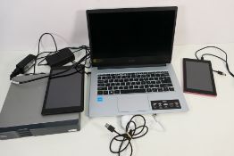 An Acer Aspire 1 A114 series 1080 HD laptop together with 2 x Amazon tablets and a Cisco router.