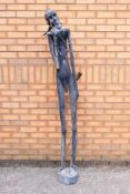 A large mid 20th century African carving of a male figure,
