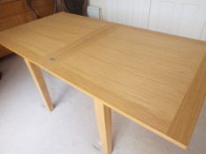 Morris Furniture Co of Glasgow - a modern light oak flip-top dining table, condition unmarked,