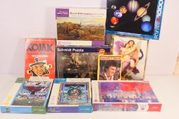 A collection of jigsaw puzzles, predominantly factory sealed including Starsky & Hutch, Kojak,
